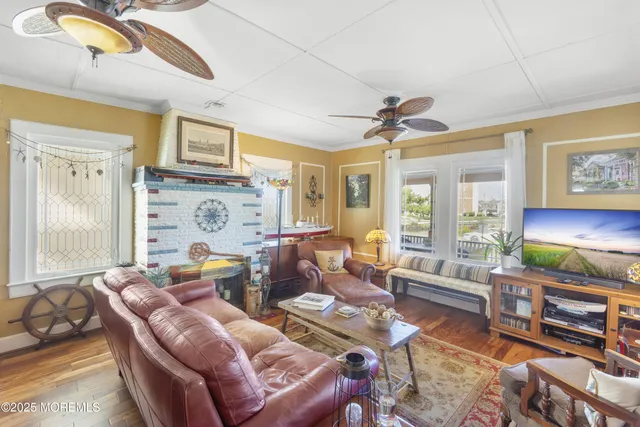 a living room with fireplace furniture and a flat screen tv