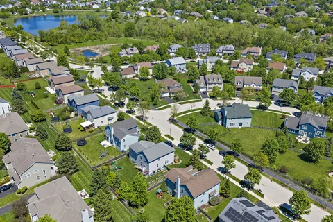 an aerial view of residential house with outdoor space and swimming pool