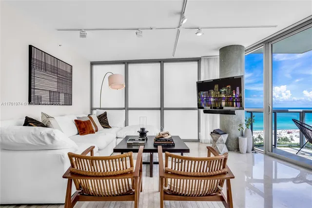 a bedroom with a bed and a table in it