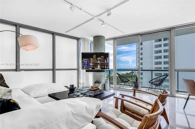 a bedroom with a bed and a tv