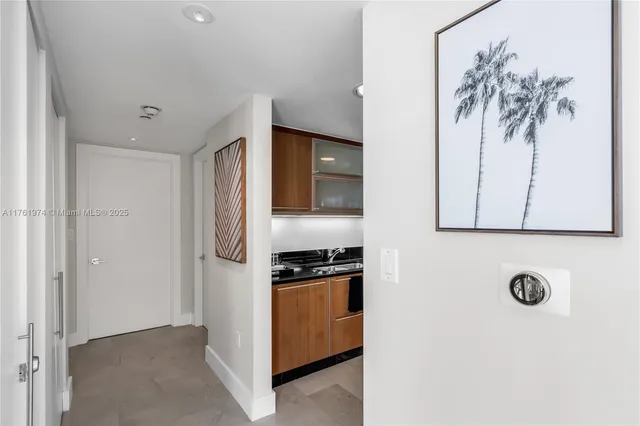 a bathroom with a toilet a sink and glass door