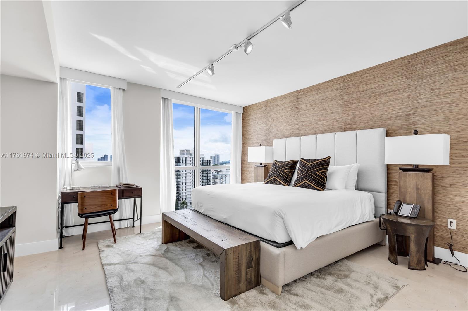 101 20th Street, Unit 1904 Miami Beach, FL 33139 - Photo 62 of 73 a bedroom with a bed and a table in it