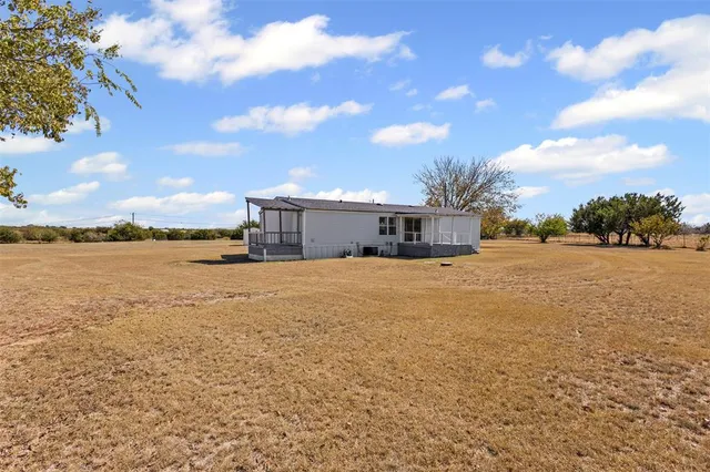 a view of a lake with a big yard