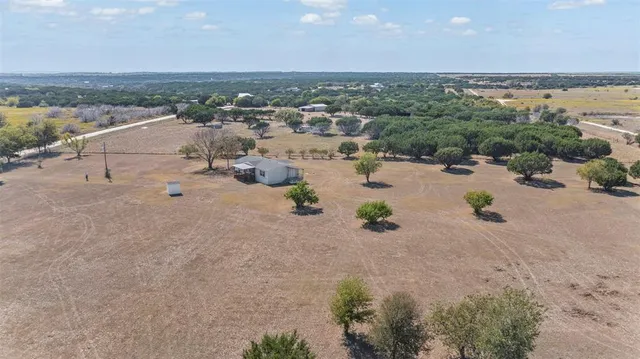 an aerial view of a beach with beach and ocean view