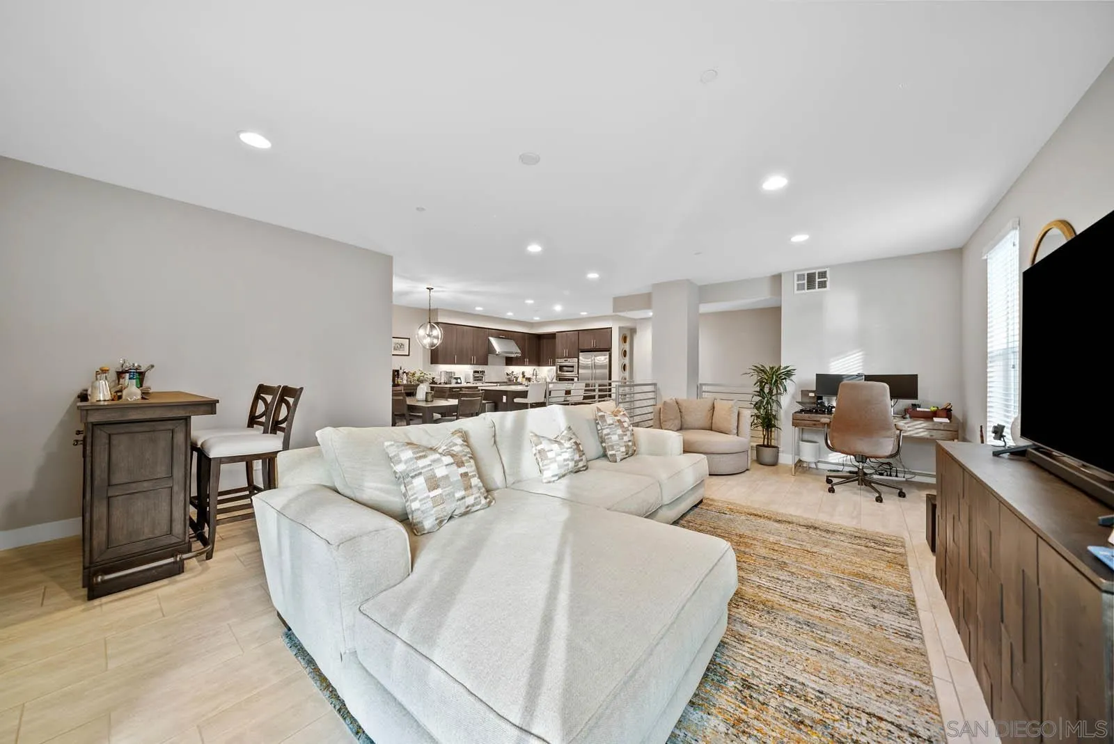 612 Rockefeller Irvine, CA 92612 - Photo 15 of 49 a living room with furniture and a flat screen tv