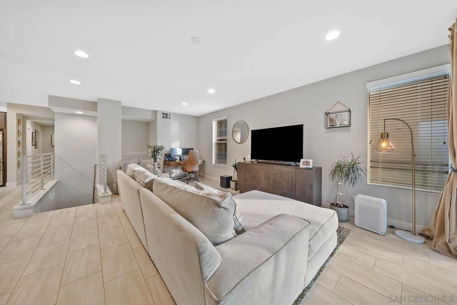 612 Rockefeller Irvine, CA 92612 - Photo 16 of 49 a living room with furniture and a flat screen tv