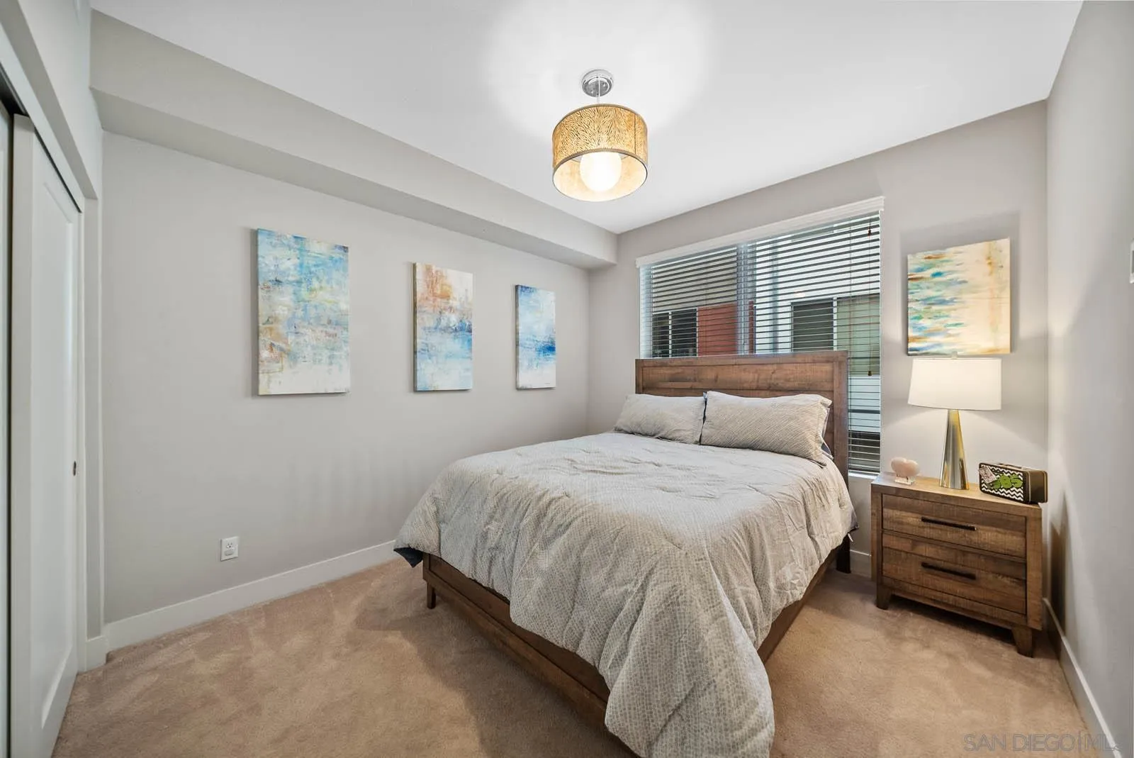 612 Rockefeller Irvine, CA 92612 - Photo 30 of 49 a bedroom with a bed and a large window