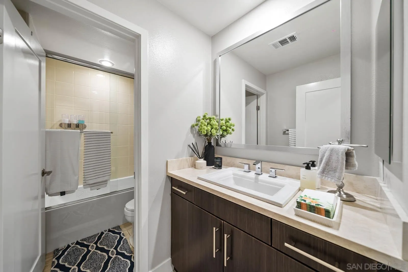 612 Rockefeller Irvine, CA 92612 - Photo 31 of 49 a bathroom with a sink and a mirror