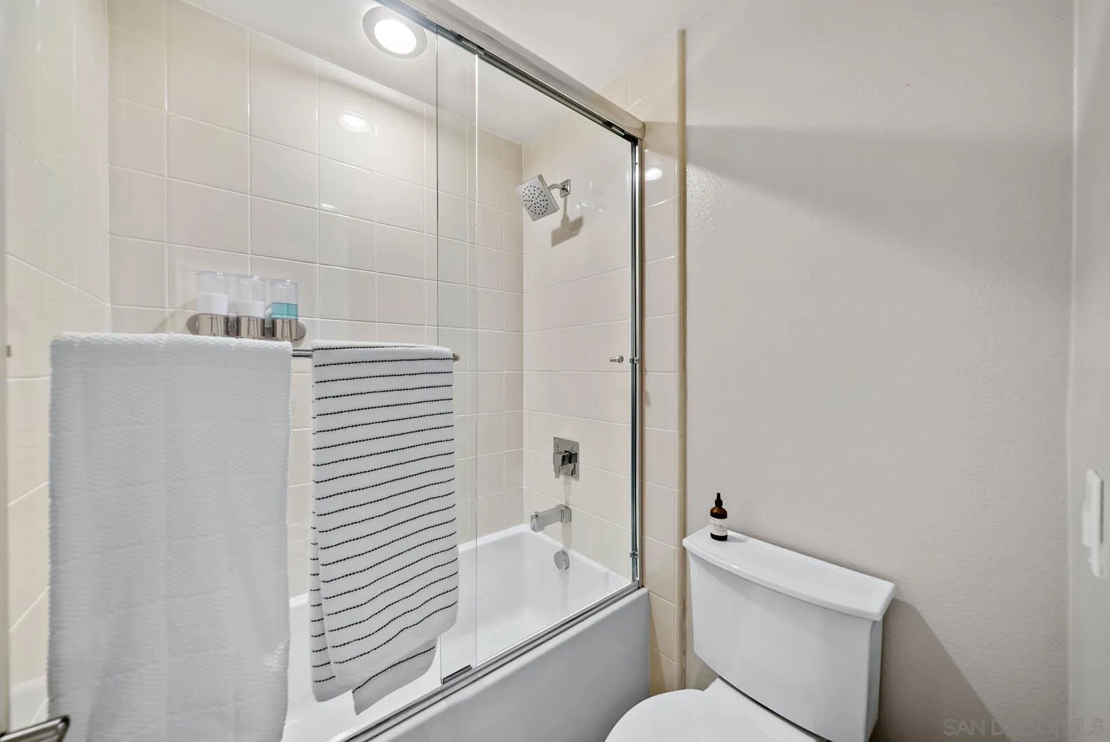 612 Rockefeller Irvine, CA 92612 - Photo 32 of 49 a bathroom with a bathtub and a shower