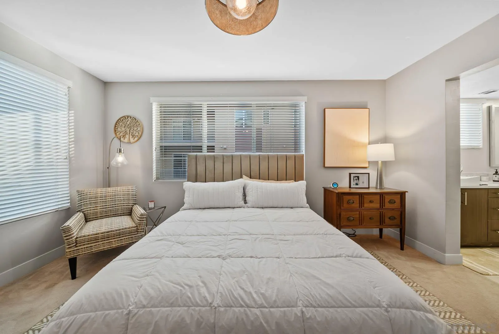 612 Rockefeller Irvine, CA 92612 - Photo 34 of 49 a bedroom with a large bed and a window