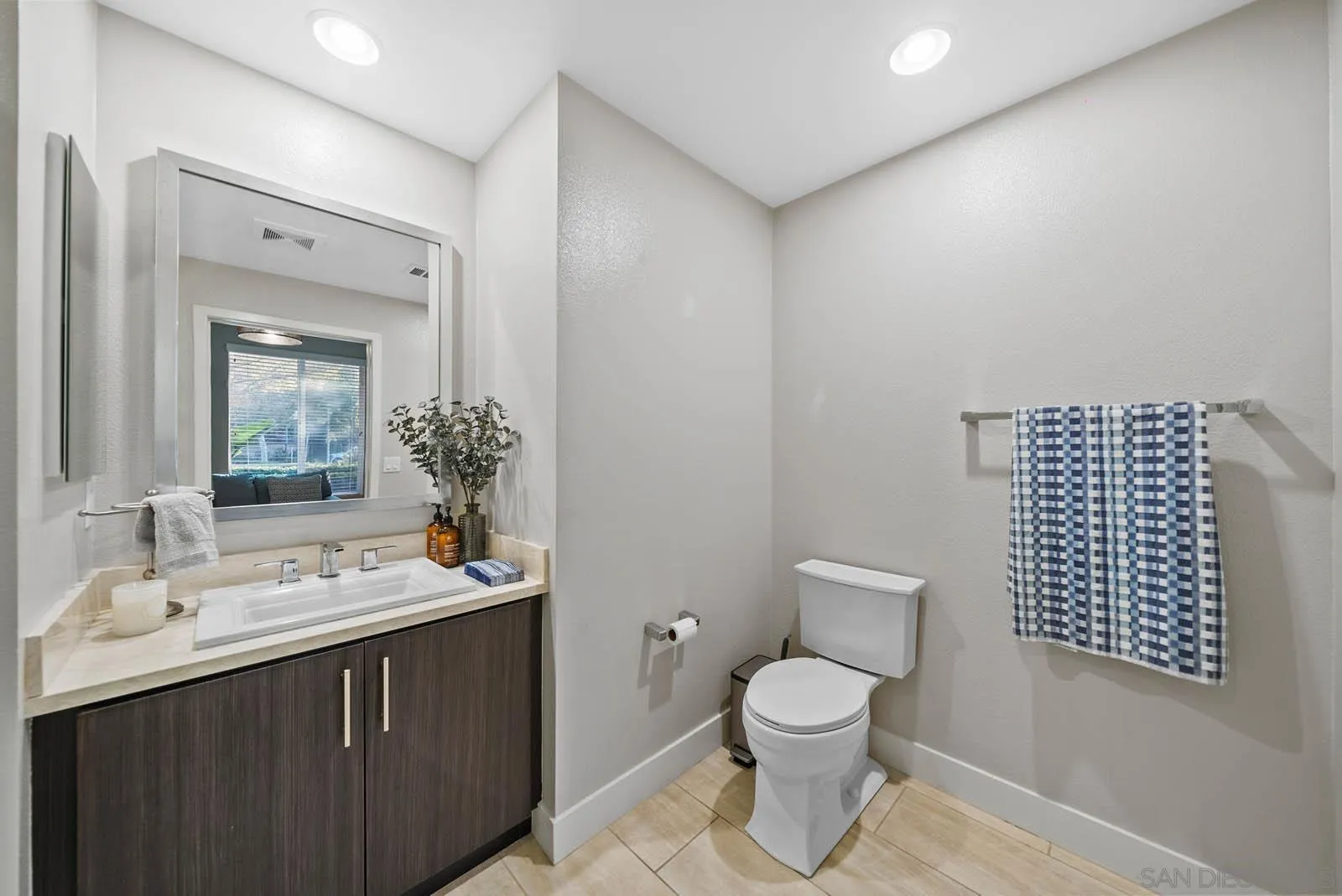 612 Rockefeller Irvine, CA 92612 - Photo 9 of 49 a bathroom with a toilet sink a mirror and shower
