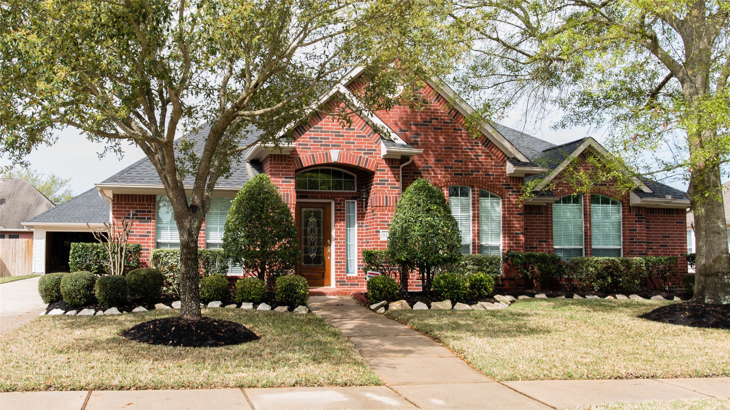 a front view of a house with garden