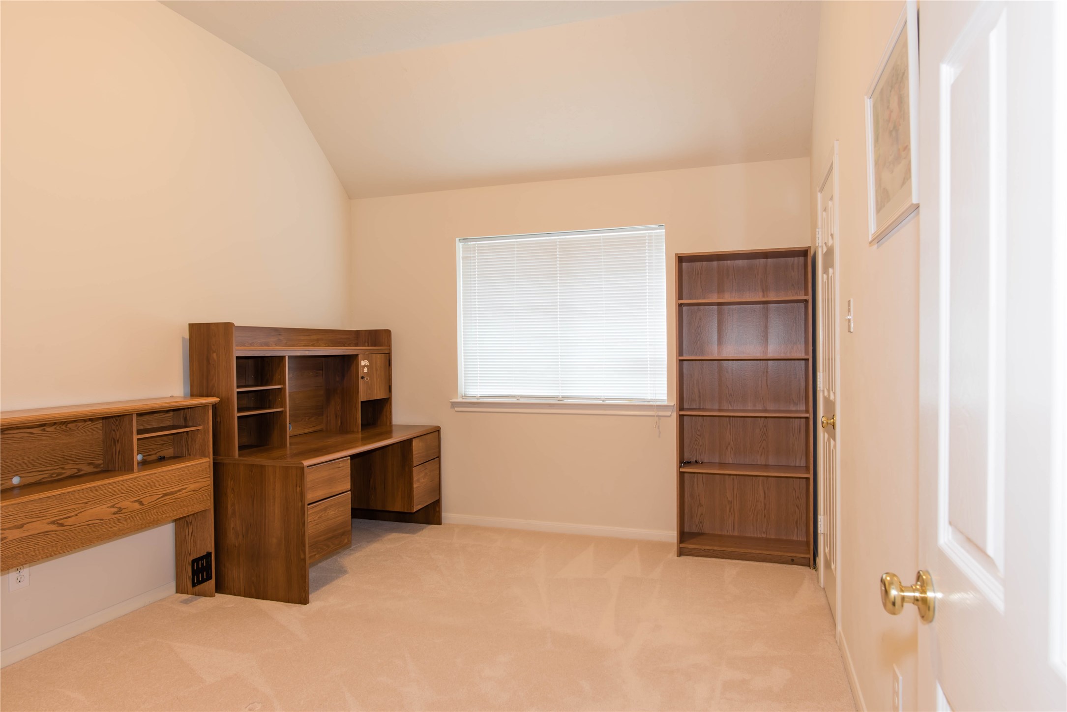 9115 Sunny Ridge Drive Houston, TX 77095 - Photo 12 of 20 a view of a refrigerator in kitchen and empty room