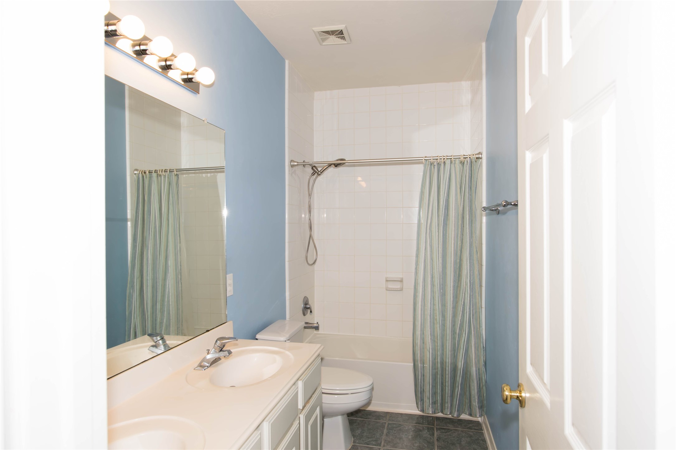 9115 Sunny Ridge Drive Houston, TX 77095 - Photo 15 of 20 a bathroom with a sink a toilet and shower