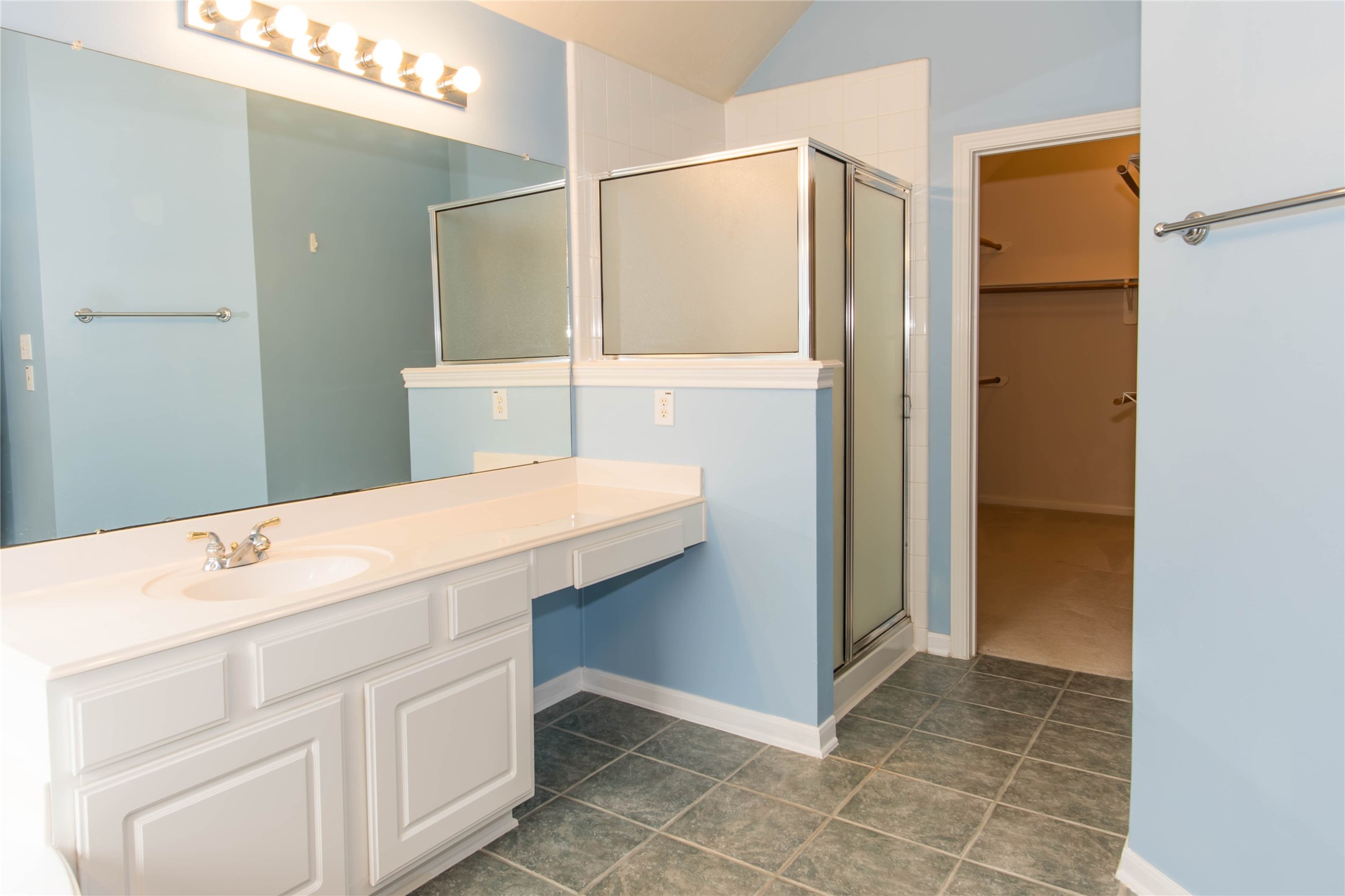 9115 Sunny Ridge Drive Houston, TX 77095 - Photo 18 of 20 a bathroom with a sink and a mirror
