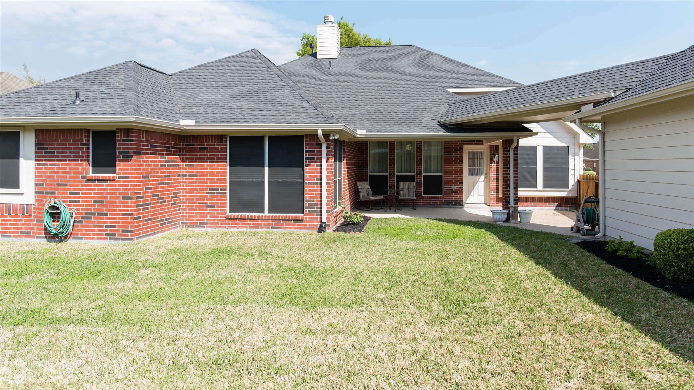 9115 Sunny Ridge Drive Houston, TX 77095 - Photo 20 of 20 a front view of a house with a yard and entertaining space