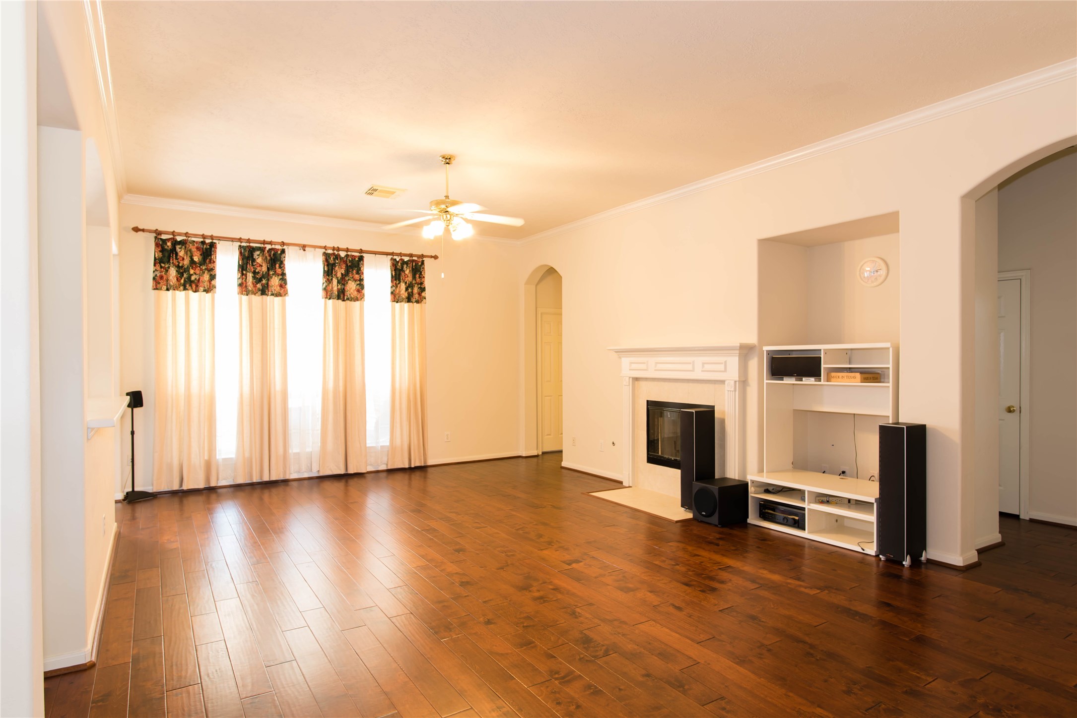 9115 Sunny Ridge Drive Houston, TX 77095 - Photo 7 of 20 a view of a livingroom with wooden floor and a fireplace