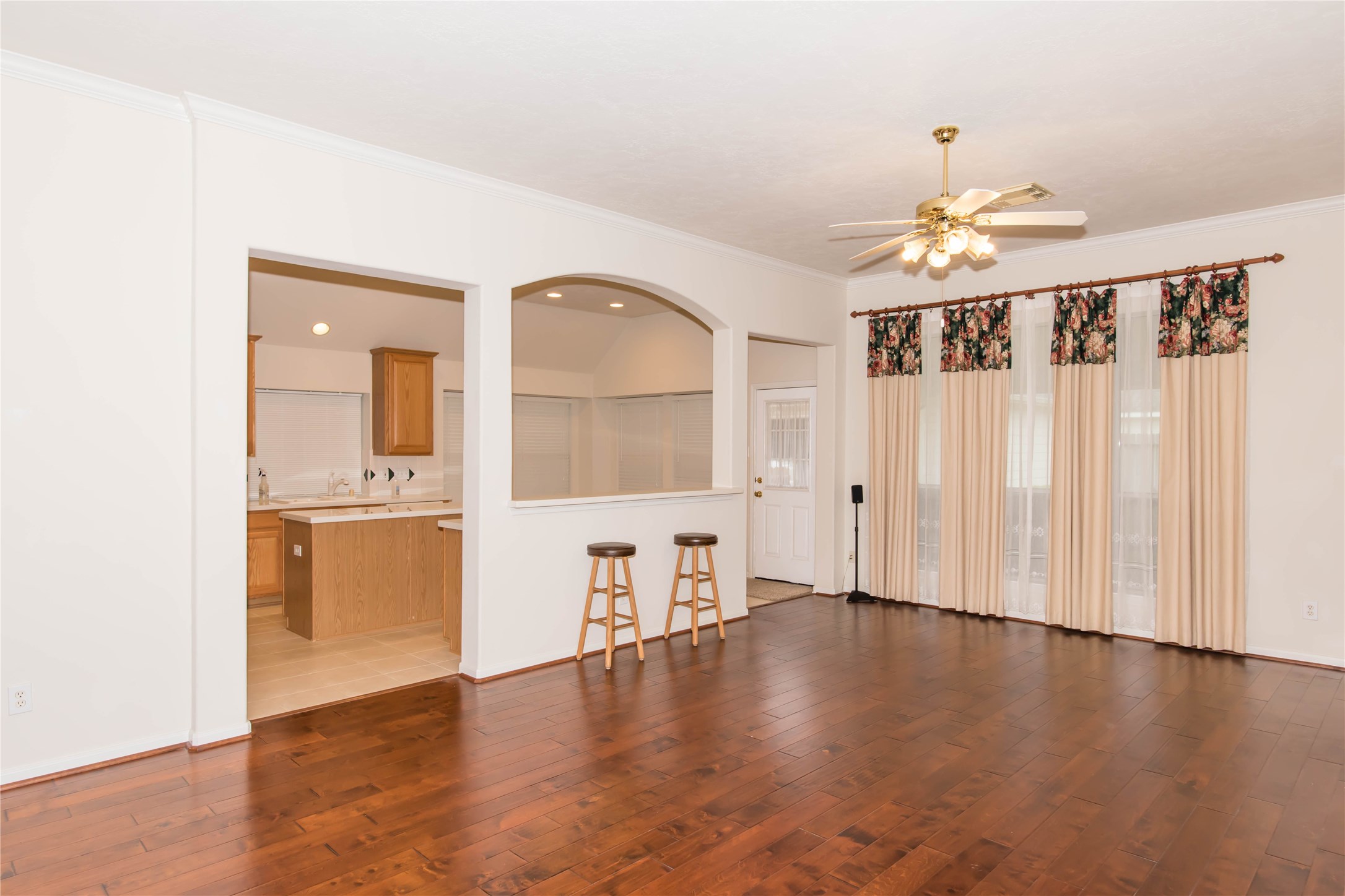 9115 Sunny Ridge Drive Houston, TX 77095 - Photo 8 of 20 a view of a livingroom with wooden floor and a kitchen space