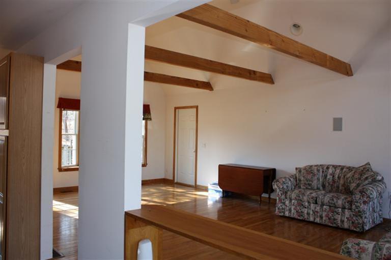 7 Pine Ridge Road Truro, MA 02666 - Photo 8 of 12 a living room with furniture and a window