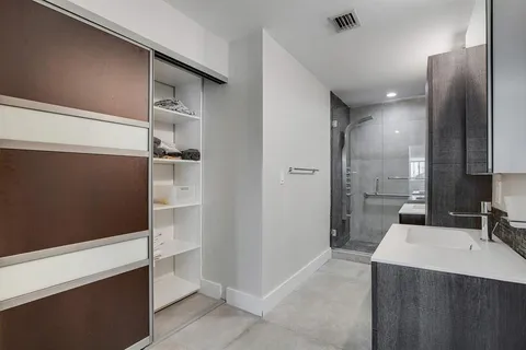 a bathroom with a sink and mirror