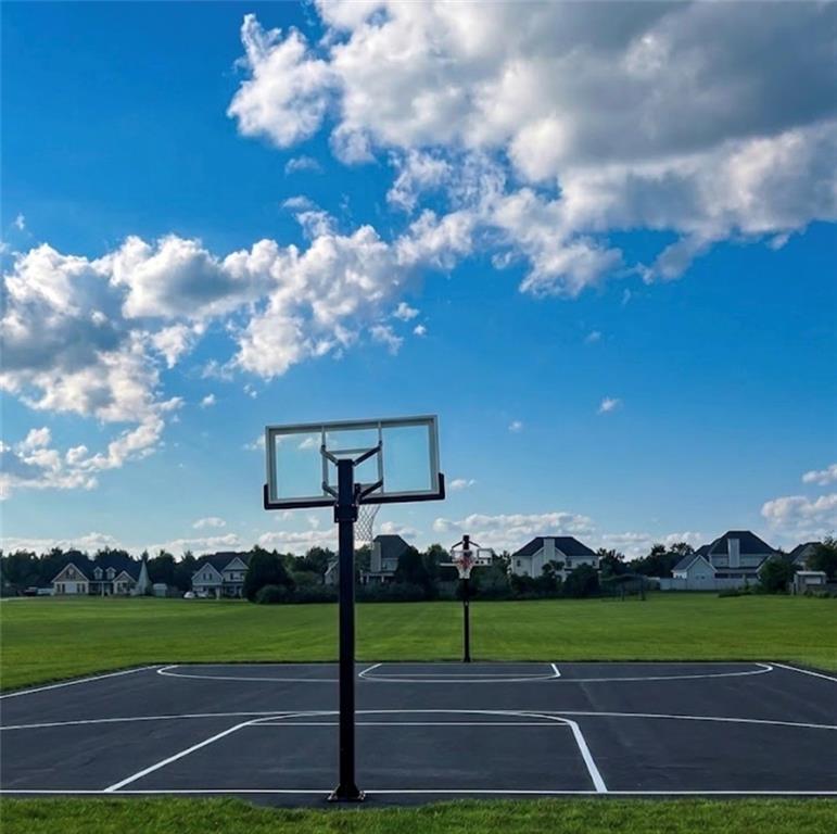 22 Pawnee Trail Fort Mitchell, AL 36856 - Photo 37 of 40 Full-size asphalt basketball court with clear backboard and perimeter lighting
