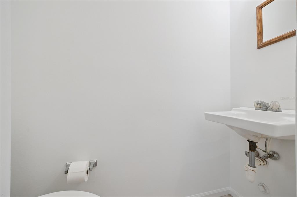 498 Green Spring Circle Winter Springs, FL 32708 - Photo 15 of 20 a bathroom with a sink a toilet and a mirror