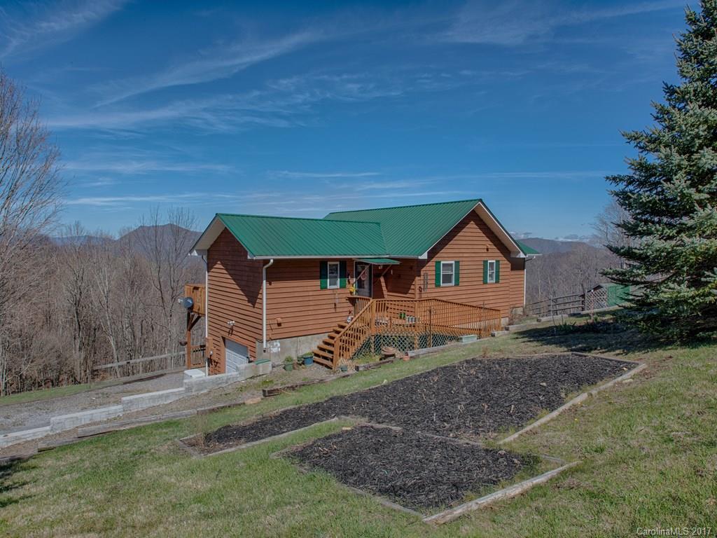 450 Windswept Ridge Road Leicester, NC 28748 - Photo 1 of 18 a house view with a outdoor space