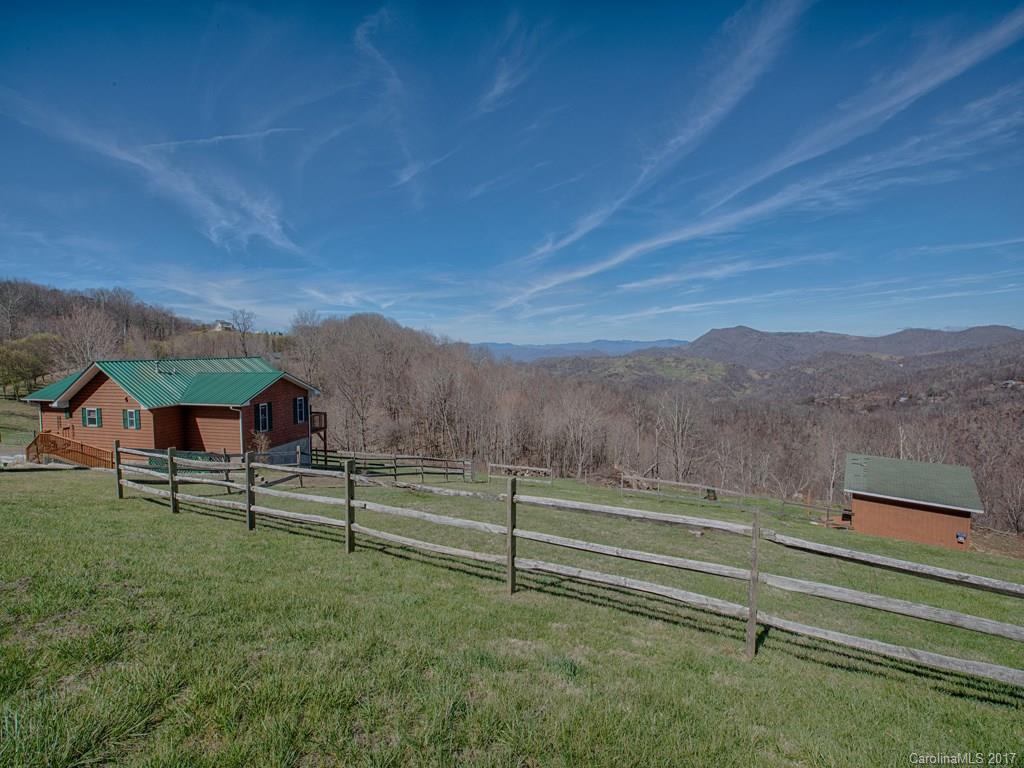 450 Windswept Ridge Road Leicester, NC 28748 - Photo 3 of 18 a view of a house with a yard