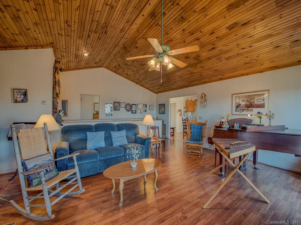 450 Windswept Ridge Road Leicester, NC 28748 - Photo 8 of 18 a living room with furniture and a wooden floor