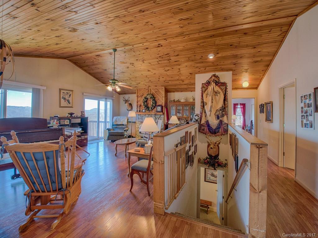 450 Windswept Ridge Road Leicester, NC 28748 - Photo 9 of 18 a view of a room with lots of wooden furniture