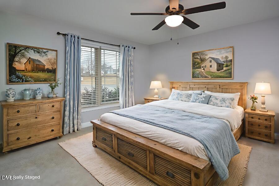 3082 East Thollie Green Road Stem, NC 27581 - Photo 23 of 45 a bedroom with a bed and a dresser in it