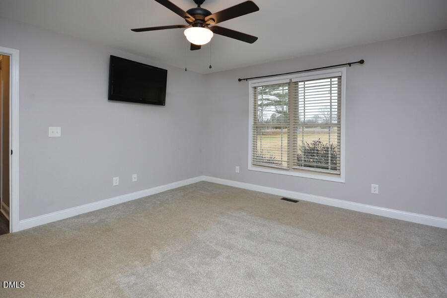 3082 East Thollie Green Road Stem, NC 27581 - Photo 24 of 45 a view of a livingroom with a flat screen tv