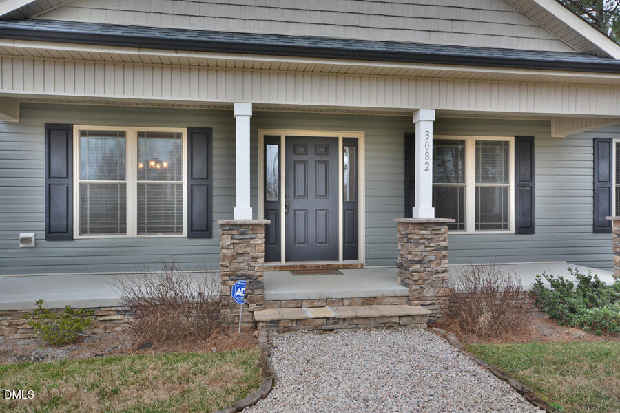 3082 East Thollie Green Road Stem, NC 27581 - Photo 3 of 45 a front view of a house