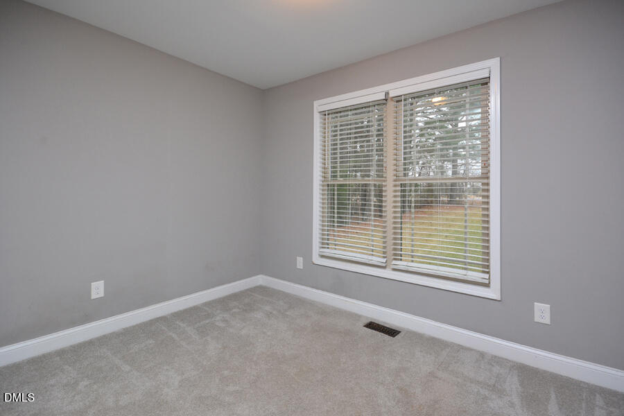 3082 East Thollie Green Road Stem, NC 27581 - Photo 31 of 45 a room that has a window in it