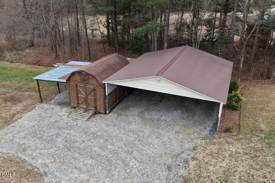 3082 East Thollie Green Road Stem, NC 27581 - Photo 42 of 45 a backyard of a house with table and chairs