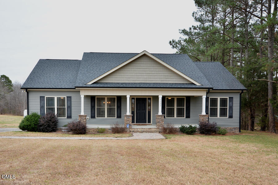 3082 East Thollie Green Road Stem, NC 27581 - Photo 45 of 45 front view of a house with a yard