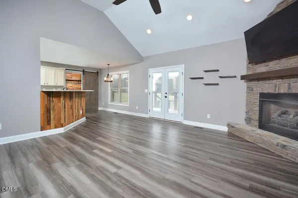 a living room with furniture fireplace and flat screen tv