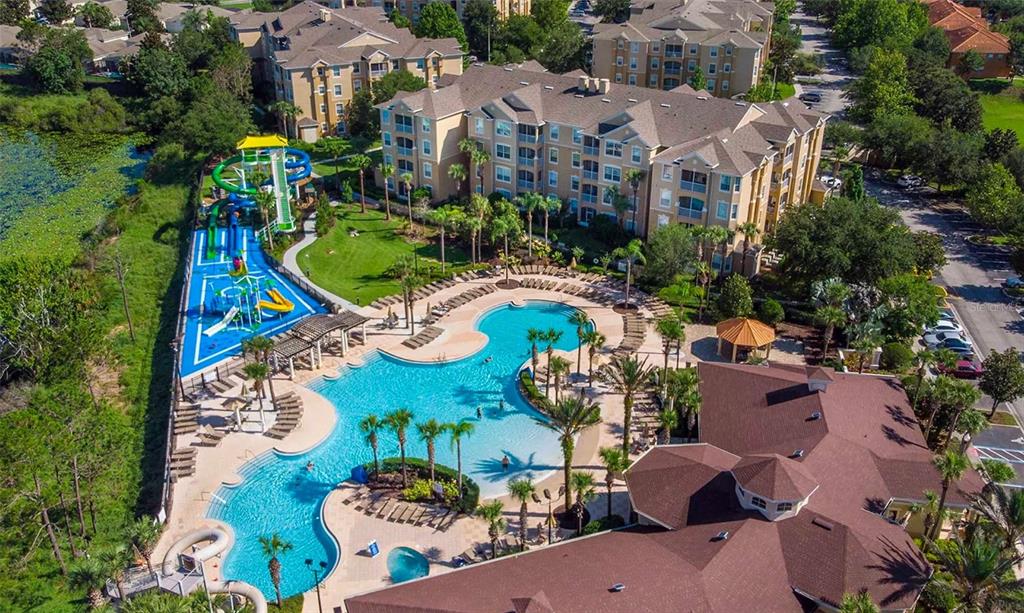 7664 Comrow Street, Unit 302 Kissimmee, FL 34747 - Photo 17 of 19 an aerial view of a house with a yard and outdoor seating