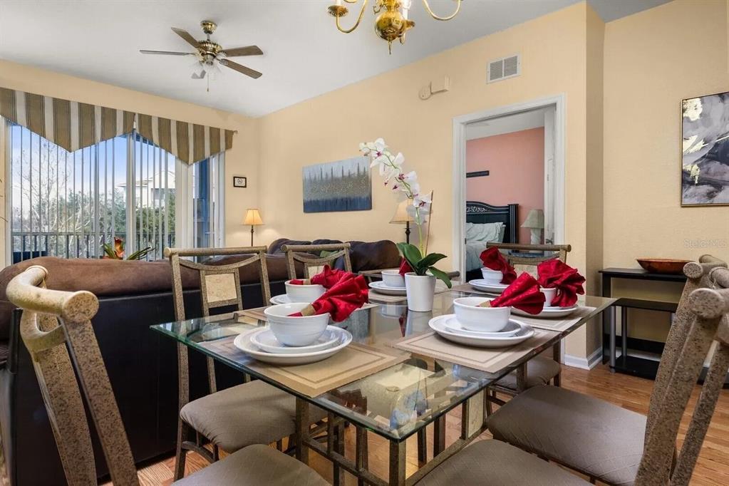 7664 Comrow Street, Unit 302 Kissimmee, FL 34747 - Photo 3 of 19 a view of a dining room with furniture window and outside view