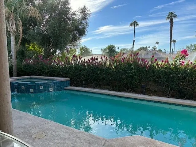 a view of a garden with a lake view