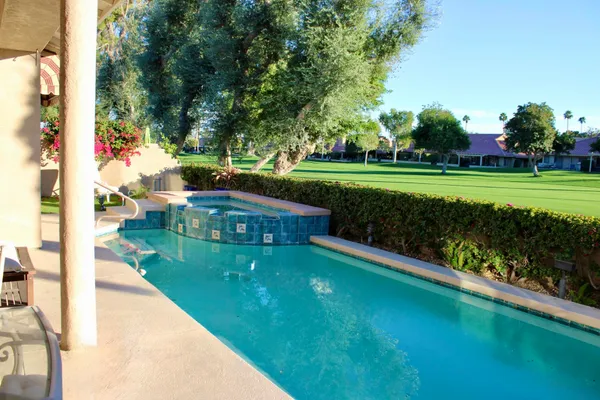 an outdoor view of garden with patio