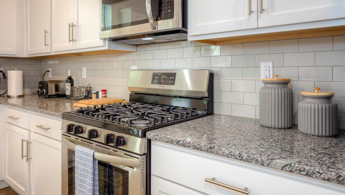 1240 Secrest Cmns Drive Monroe, NC 28112 - Photo 16 of 39 a kitchen with granite countertop stainless steel appliances and cabinets