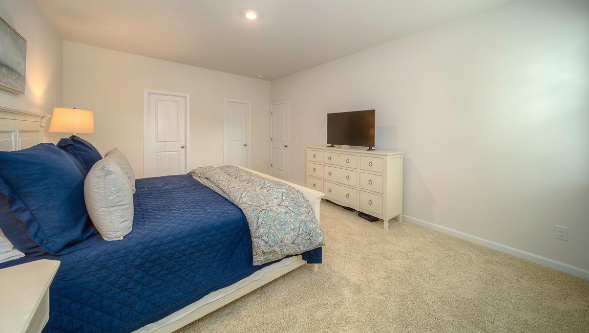 1240 Secrest Cmns Drive Monroe, NC 28112 - Photo 21 of 39 a bedroom with a bed and a television