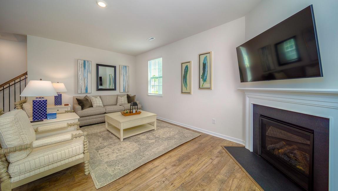 1240 Secrest Cmns Drive Monroe, NC 28112 - Photo 8 of 39 a living room with furniture a flat screen tv and a fireplace