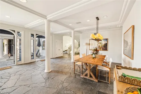a kitchen with stainless steel appliances granite countertop a sink and a refrigerator
