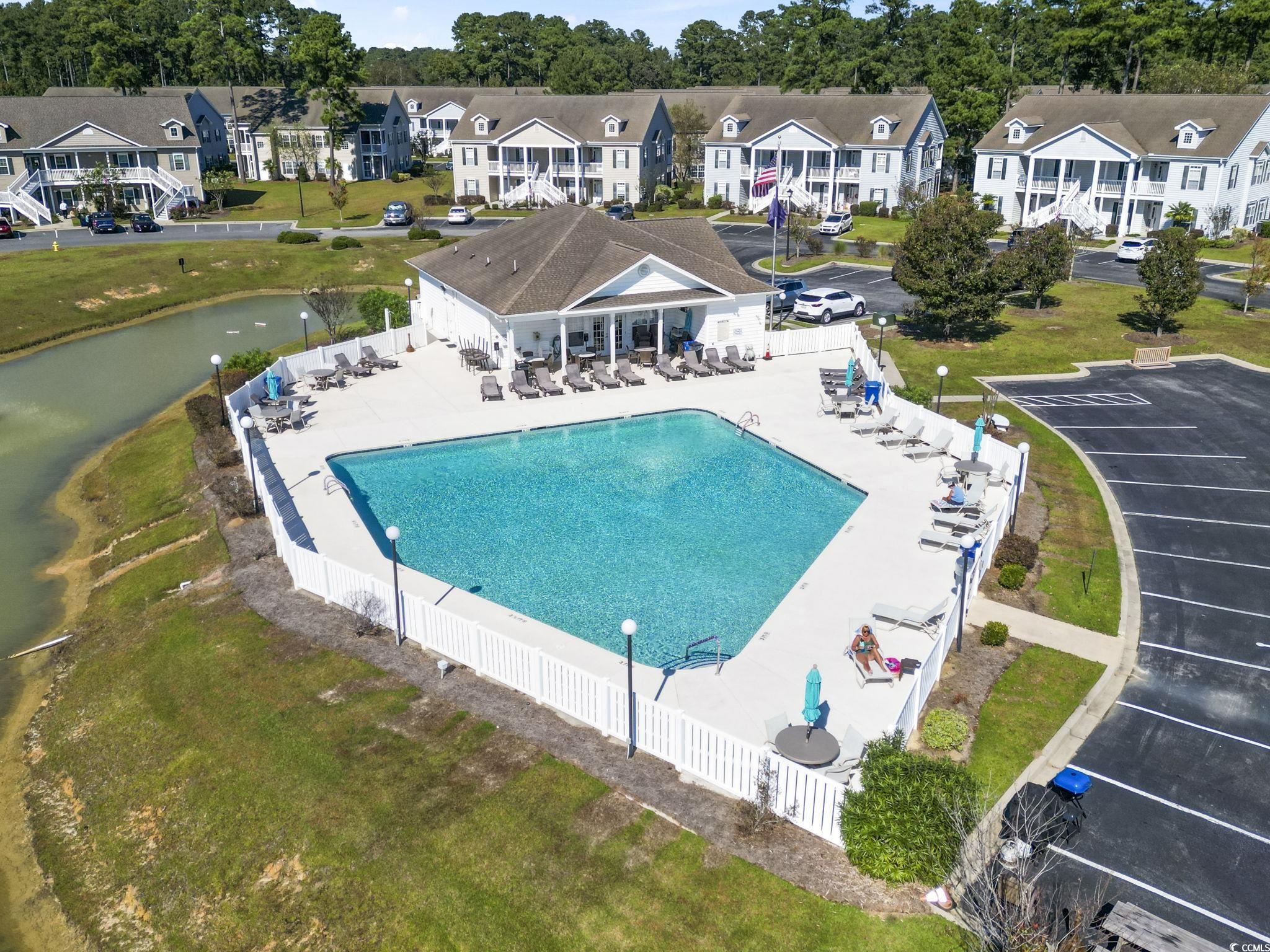 237 Moonglow Circle, Unit 102 Murrells Inlet, SC 29576 - Photo 33 of 35 Property entrance featuring a yard and ceiling fan