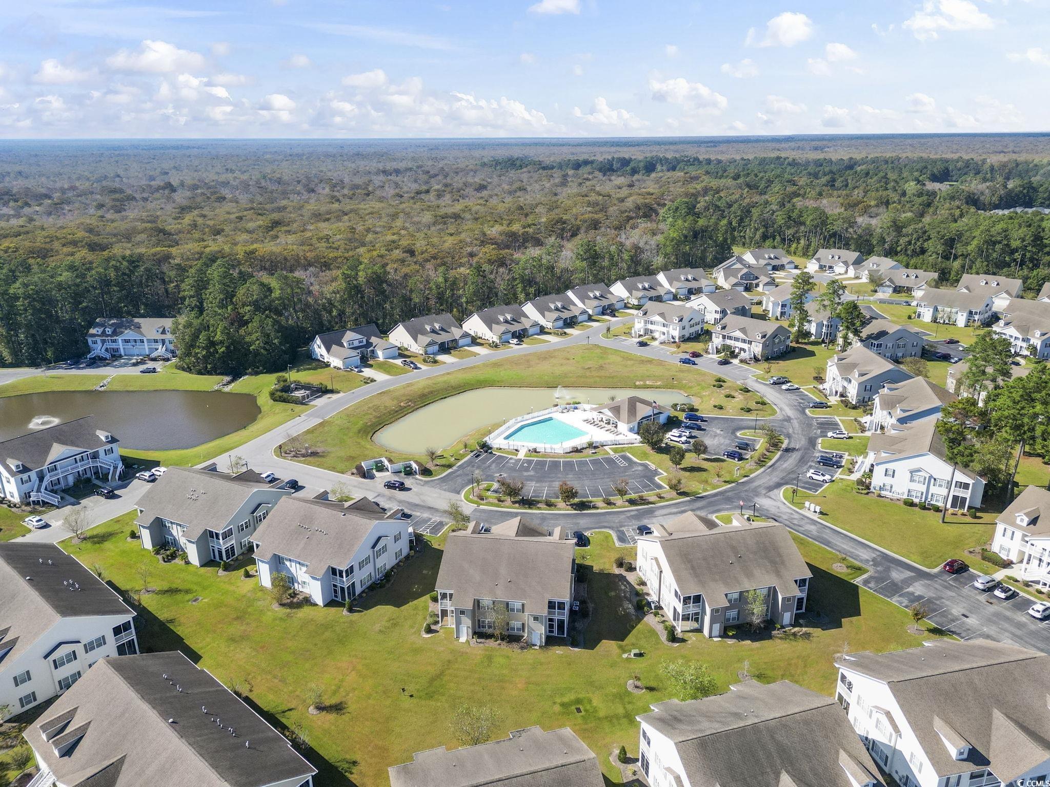 237 Moonglow Circle, Unit 102 Murrells Inlet, SC 29576 - Photo 34 of 35 Community pool featuring a patio