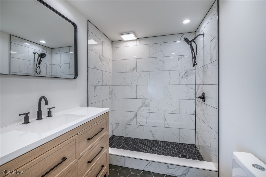 24534 Mill Road Utica, OH 43080 - Photo 12 of 38 Full bath featuring walk in shower, vanity, and recessed lighting