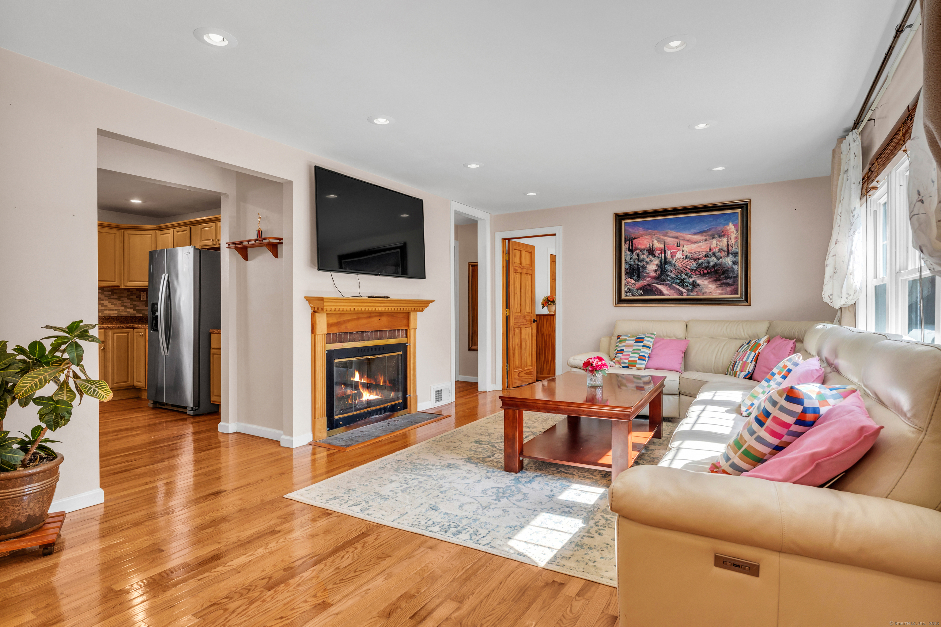 64 Dohm Avenue Guilford, CT 06437 - Photo 7 of 38 Living room has a wood burning fireplace