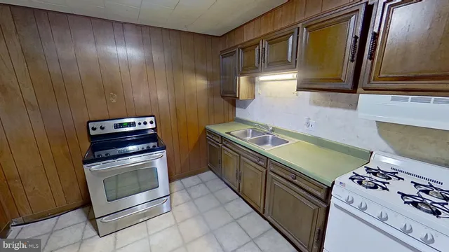 a kitchen with a stove and a microwave